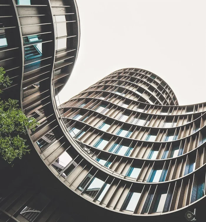 curved building upward view angle toward sky