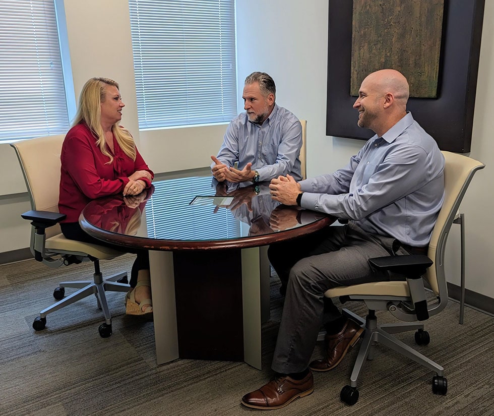 Grubb Properties Team talking around business table